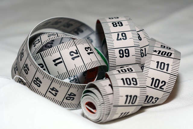 measuring tape combination square marking knife on wooden board for furniture layout